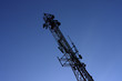 Silhouette of communication tower, twilight sky background