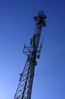 Silhouette of communication tower, twilight sky background.