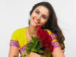 beautiful young woman with a bouquet of roses
