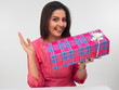an attractive young woman with a gift box