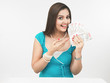 asian female of indian origin with currency notes