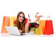 Beautiful young woman shopping over internet Beautiful young woman shopping over internet