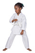 Small karate girl training , isolated on white background