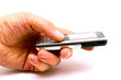 The hand of man holding the mobile phone isolated