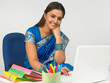 female business executive working on her laptop