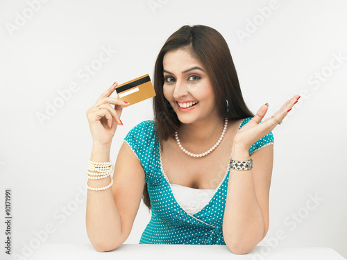 Photo: beautiful young asian female with her credit card beautiful young asian female with her credit card