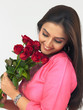 woman with a bouquet of red roses
