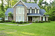 Executive brick home with greenery and trees Executive brick home with greenery and trees