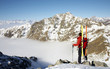 Male ski-climber at the summit of his climbing Male ski-climber at the summit of his climbing
