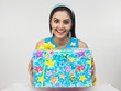 beautiful young asian woman of indian origin with a gift box beautiful young asian woman of indian origin with a gift box