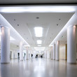 White hall of office centre, people move