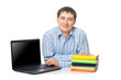 young adullt man sitting with laptop and books