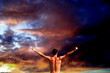 Muscle man exulting in the clouds