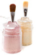 Light pink and gold make-up eye-shadows and brushes