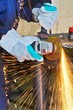 Yellow hot sparks at grinding steel material
