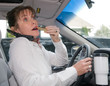 Woman Multi-Tasking while Driving Woman Multi-Tasking while Driving