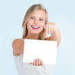 Cut out of  girl pointing down at billboard