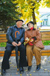 happy grandparent on bench in park happy grandparent on bench in park
