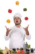 funny chef juggling with peppers in colors funny chef juggling with peppers in colors