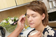 Applying powder on face of girl at home Applying powder on face of girl at home