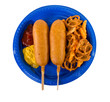 Junk food meal with focus on corn dogs