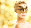 Beautiful young woman in carnival mask