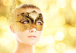 Beautiful young woman in carnival mask