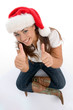 beautiful female wearing christmas hat on white background