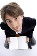 man holding notebook and looking upward on white background