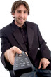 smiling man showing tv remote on an isolated white background