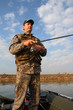 men fishing with spinning on the river