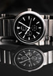 Men's wrist watch on black background. Studio shoot.