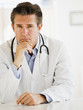doctor at desk in office.