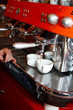 two coffee cups on The coffee device/machine (#3).