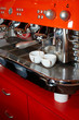 two coffee cups on The coffee device/machine (#3).