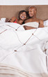 african american couple in bed having fun