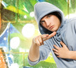 Cool looking man in a hood over abstract graffiti background Cool looking man in a hood over abstract graffiti background