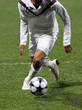Soccer player running after the ball