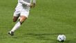 Soccer player running after the ball