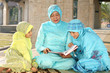 Muslim Mother and Kids Reading Qur'an