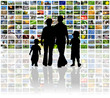 family watching television on huge lcd panel