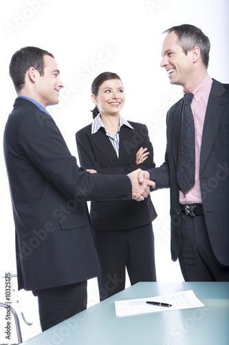 Foto: Business people shaking hands Business people shaking hands