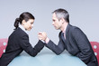 Two business people in a duel