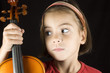 closeup portrait from little girl with violin isolated on black