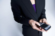Photo: Business woman with a smartphone close up Business woman with a smartphone close up