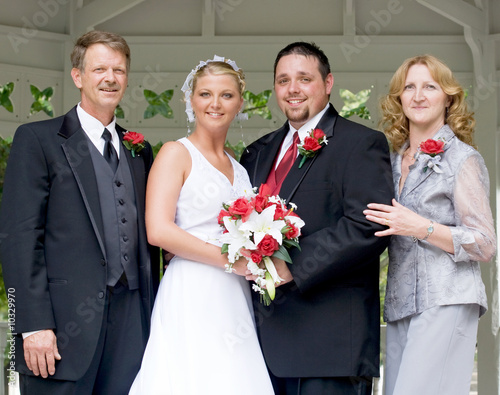 Photo: Bride and Groom With Her Parents Bride and Groom With Her Parents