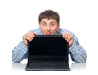 young adult man behind the laptop, isaolated on white background