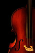 Cello, in close-up with black background. Natural warm light. Cello, in close-up with black background. Natural warm light.