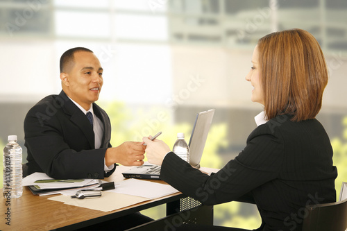 Photo: woman hand over pen. concept signing contract or deal woman hand over pen. concept signing contract or deal