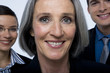 Portrait of  woman and her team